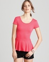 This pretty-in-pink Aqua top flaunts a ladylike peplum for a feminine spin on the basic style.