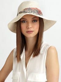 Soft linen, in a floppy style accented with a printed, ruched band of chiffon.Ruched chiffon bandBrim, about 3LinenHand washMade in USA of imported fabric