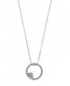 Eternal design accented by just the right amount of sparkle. 2028 pendant features a cut-out circular style accented by a chic flower and acrylic stones. Setting and chain crafted in silver tone mixed metal. Approximate length: 16 inches + 3-inch extender. Approximate drop: 1-1/4 inches.