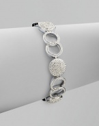 A gorgeous piece featuring circles and links accented with brilliant pavé crystals. CrystalsRhodium-plated brassLength, about 7¼ Tongue-and-box closureImported 