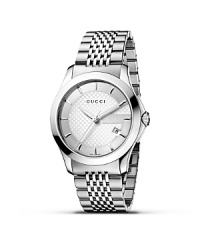 A stainless steel watch from the Gucci G-Timeless collection. Round silver dial with pattern and stick hour indices. Sweep second hand and date window.