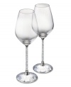 Make it a memorable dining experience with Swarovski Crystalline wine glasses. A faceted base, polished metal accents and stems filled with glittering chatons turn an ordinary meal into cause for celebration.