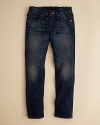 A beautifully damaged jean from True Religion, replete with heavy fading, dirty dyes and bleached-out wrinkles.