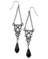 Open to the idea of something new? These doorknocker earrings from GUESS are crafted from hematite-tone mixed metal with jet beads and glass crystal stones. A filigree pattern enhances the look. Approximate drop: 3-1/4 inches. Approximate diameter: 3/4 inch.