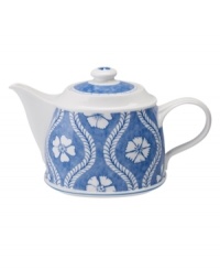 Vintage charm meets modern durability in the Farmhouse Touch teapot, featuring white laurels and blooms on cornflower-blue porcelain from Villeroy & Boch.