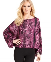 Vince Camuto combines a head-turning print with a knockout silhouette for this latest blouse.