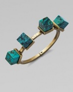 An architectural piece with four turquoise cube stones on a hinged bangle. TurquoiseBrassDiameter, about 2½Hinged closureMade in USA