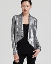 Dress up separates with this sparkling Donna Karan New York sequin jacket, embellished with a confection of silver sequins for a smashing effect. Elegant for evening, this luxe layer is a cocktail wow piece.