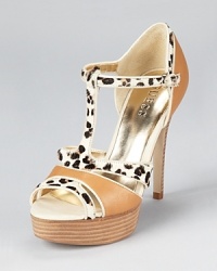 In luxe leather and leopard print calf hair, these standout GUESS sandals make a daring statement after hours.