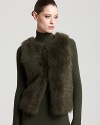 Plush fur lends exotic edge to a Rachel Roy vest, finished with a ribbed knit back for a modern mixed-media silhouette.