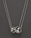 This sterling silver pendant represents the love between a mother and her child. By Di MODOLO.