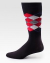 Bold, colorful argyle patterns with striped detail accents this dapper dress sock, crafted from a comfortable stretch cotton blend for long-lasting style and support.Mid-calf heightCotton/polyamide/modal/elastane Machine washImported