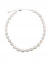 The infinity round necklace from Charter Club is sure to add sparkle to your special occasion style. Crafted in silver tone mixed metal, it's ornately embellished with glass accents and simulated pearls. Approximate length: 16 inches + 3-1/2 inch extender.