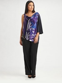 If you're looking for a flattering top to truly complement your shape, look no further than this stretch-satin design featuring an irresistible print. Pair it with your favorite straight-leg or slim-fit pants. One-shoulder styleDraped necklineOne sleeveGraphic print on frontAbout 30 from shoulder to hem97% polyester/3% elastaneDry cleanImported