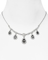 This delicate Carolee necklace styles your look with effortless elegance, set in silver plated metal and accented by mesmerizing teardrop-shaped crystals.