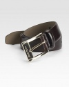 A smooth and sophisticated belt designed in fine calfskin leather with a shiny gold buckle. About 1 wide Imported 