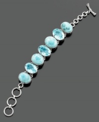 Cool blue stones of larimar and blue topaz (25 ct. t.w.) with sterling silver will set your style on a sophisticated wave. Measures approximately 8 inches long.