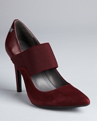 Calvin Klein reinterprets a classic pump, mixing smooth leather with soft suede.