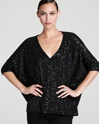 Dripping with decadence, a statement DKNY top illuminates your look as allover sparkle stuns against an oversized silhouette.