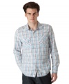 Get that laid-back look that is all casual cool with this weathered plaid shirt from Calvin Klein Jeans.