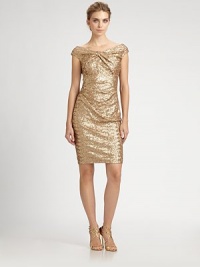 Sparkling metallic sequins and a twisted neckline define this party-perfect style.Twist-front necklineCap sleevesAllover sequinsConcealed back zipFully linedAbout 21 from natural waistPolyesterDry cleanMade in USA of imported fabricModel shown is 5'10 (177cm) wearing US size 4. 