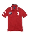 A preppy short-sleeved polo shirt in breathable cotton mesh is accented with London embroidery and a US Olympic Team embroidered emblem, celebrating Team USA's participation in the 2012 Olympics.