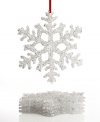 Looks like snow. Elegant snowflakes offer a touch of luminous charm to your tree in this set of 6 Holiday Lane ornaments.