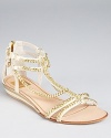 Embellished in golden chains, these hardware-heavy Dolce Vita sandals lend a luxe look.