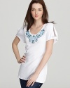 This BASLER tee gets a feminine update with knotted slit sleeves and a bib of intricate turquoise beading. Pair this playful piece with jean shorts for a look that is casually chic.