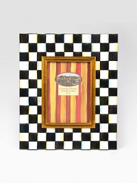 Display your treasured moments in this opulent, hand-painted frame with gilt inner molding.Hand-painted checks on enameled steelGlassAccommodates a 5 X 7 photographOverall, 11 X 13Linen-covered easel and backImported