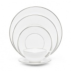 Jasper Conran continues to close the gap between formal dining and casual living. He accents the contemporary beauty of his already popular white bone china range with a touch of formality in the forum of a thin platinum band. To create an interplay of proportions, accent pieces including a plate, a charger, a small pitcher, mug, teacup and saucer, use thick platinum stripes to reinforce the pattern's look of sophisticated elegance.