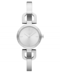 Refined and elegant, this polished steel watch from DKNY delicately graces your wrist with a subtle bangle bracelet.