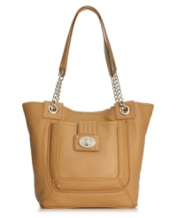 Whether you're running errands around town or meeting the girls for brunch, this go-anywhere tote from Calvin Klein is the obvious choice. Buttery-soft leather is adorned with shiny silver-tone hardware and subtle detail stitching, while plenty of pockets inside and out offer effortless organization.