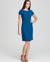 Stun from all angles as a contrast back and geometric side insets lend this T Tahari dress effortless figure flattery.