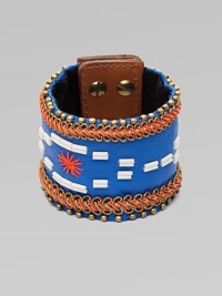 A wide cuff of bright leather, edged with golden beads and chains, stitched in colorful cord, with a center bugle-bead design.LeatherGoldtoneCotton backingLength, about 8½Width, about 2¾Stud snap closureImported