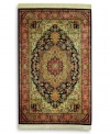 A beautiful example of traditional heriz designs, this rug features a bold navy center medallion surrounded by intricate florals in lighter shades of red and green. The combination of graceful lines and geometric shapes creates an exquisitely balanced pattern. Each color is individually skein-dyed for jewel-tone clarity. A patented wash process creates a vintage finish faithful to the craftsmanship of the original. Woven in the USA of premium fully worsted New Zealand wool.