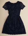 Dress her up in this classic lace dress with sheer sleeves.