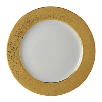 Featuring a spectacular patterned band that recalls the golden majesty of sunlight, this superior plate from Bernardaud lends dramatic sophistication to your elegant table setting.