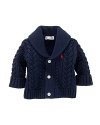 A soft cabled cotton cardigan is knit with a shawl collar and signature details for a heritage look.