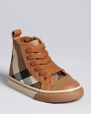 Burberry updates a classic basketball sneaker with a combination canvas check and leather upper.