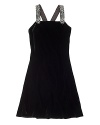 A luxuriously plush velvet dress is highlighted with beaded straps and a sleek silhouette for the perfect party attire.