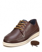 Tumbled leather boat shoe with contrast leather lace-up closure and comfy rubber sole.