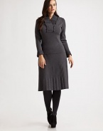 This pretty style featured a ruffled, pleated v-neck and pleated cuffs. Ruffled, pleated v-neck Long sleeves with pleated cuffs Pull-on style Wool Dry clean Made in Italy 