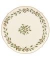 Perfect for entertaining, this round platter is trimmed with gold and a holly motif to match the beloved Lenox Holiday dinnerware collection.