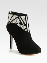 Geometric python cutouts and metal goldtone studs top this buttery suede ankle boot with a hidden platform for superior fit. Self-covered heel, 4¼ (110mm)Hidden platform, ¾ (20mm)Compares to a 3½ heel (90mm)Suede upper with python cutouts and gold metal studsBack zipLeather lining and solePadded insoleImported