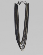 An edgy piece with a beautiful drape in 18k gold and blackened sterling silver box link chains. 18K goldBlackened sterling silverLength, about 18Toggle closureImported 