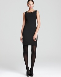 Rev up your LBD portfolio as gold-tone studs and chic cutouts lend rocker-chic inspiration to a classic DKNY shift dress.