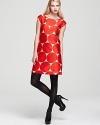 A silk luster elevates a classic kate spade new york shift dress finished in a mod-inspired print for retro polish.