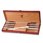 Eight stainless steel steak knives in a beautiful wood gift box by J.A. Henckels, a name synonymous for unsurpassed quality and craftsmanship.