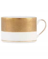 Make any occasion memorable with Gold Dust dinnerware. Combining the urbane style of Donna Karan with the renowned craftsmanship of Lenox, this timeless bone china cup radiates luxury with a wide band of matte-textured gold.